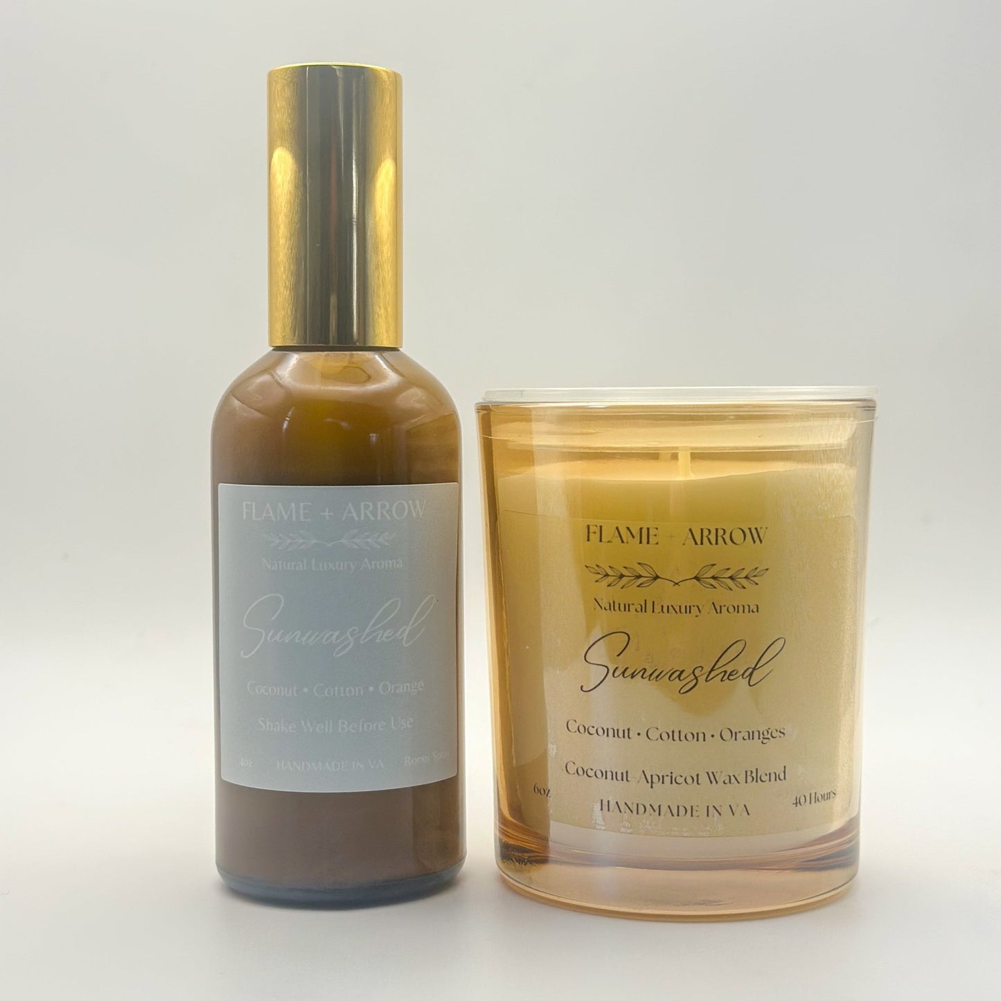 A car diffuser bottle and a candle with 'Sunwashed' written on them, indicating the scent or brand.