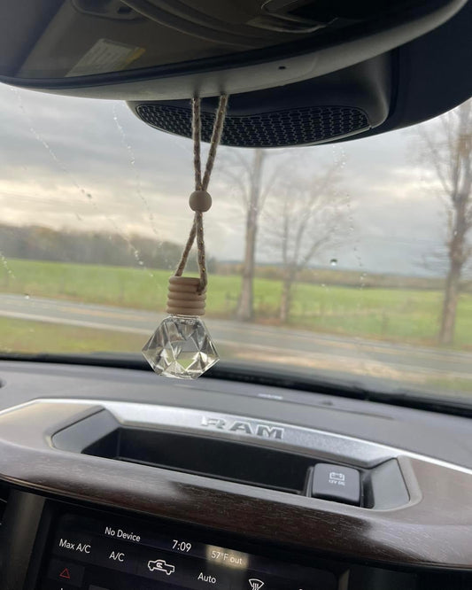 Toxin free, long-lasting car diffuser made with essential oil infused fragrance and a sustainable bamboo cork.