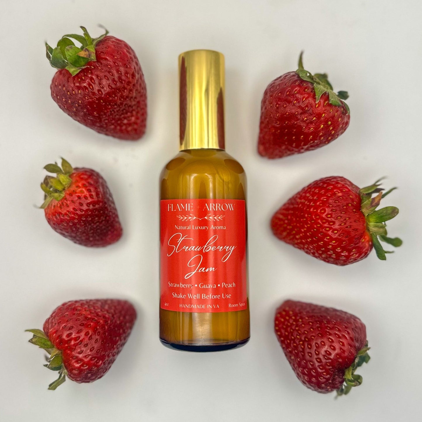 Bottle of Strawberry Jam with strawberries on a white background