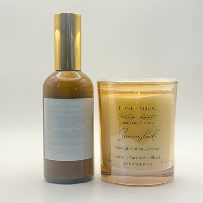 A car diffuser bottle and a candle with 'Sunwashed' written on them, indicating the scent or brand.