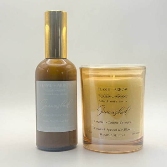 A car diffuser bottle and a candle with 'Sunwashed' written on them, indicating the scent or brand.