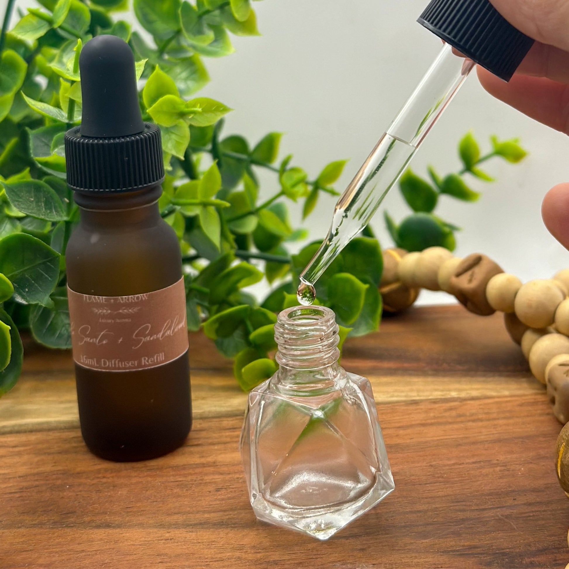 Car Diffuser refill dropper in palo santo sandalwood scent.