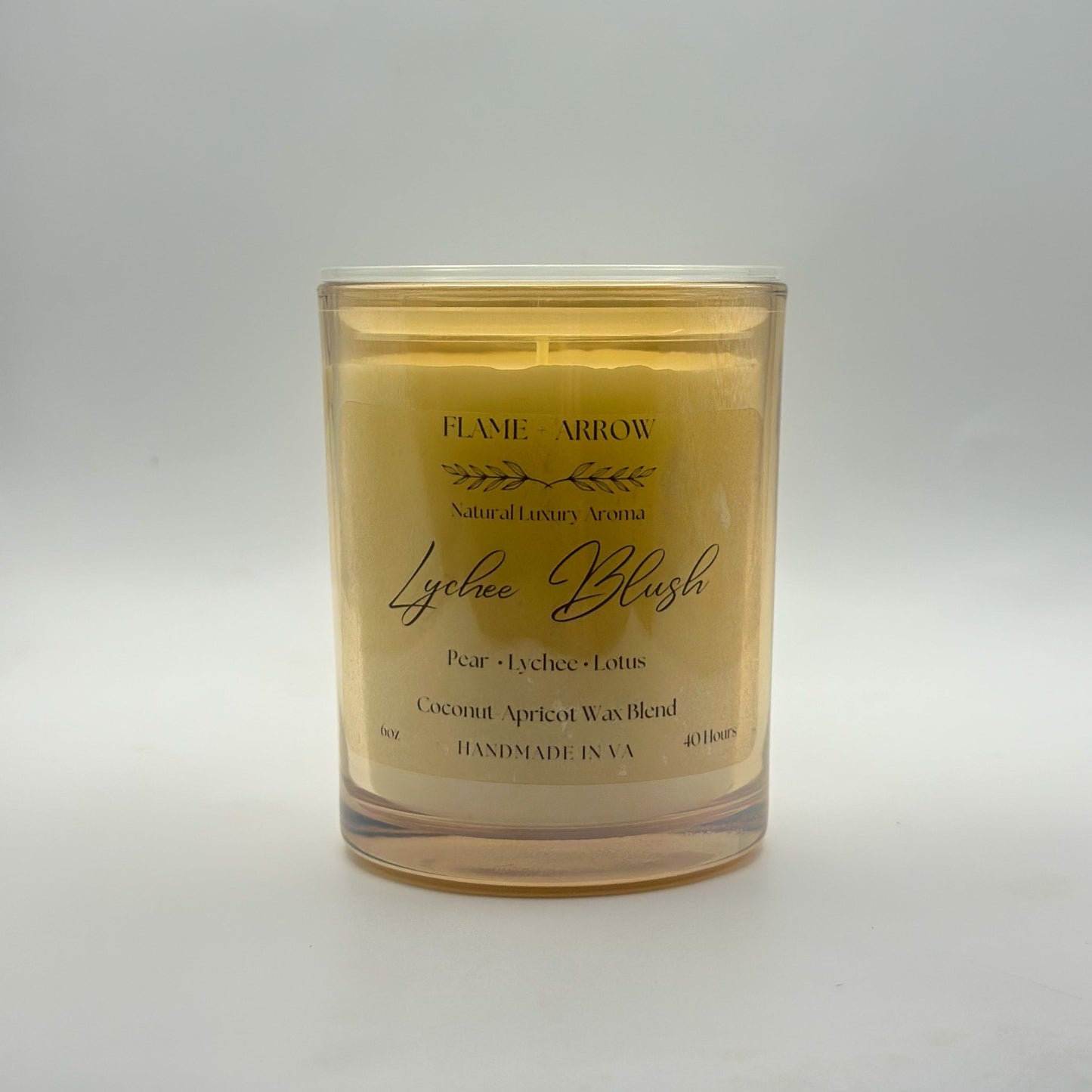 A coconut-apricot wax candle scented as Lychee Blush.