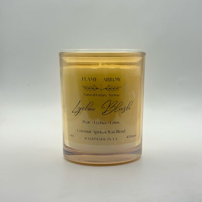 A coconut-apricot wax candle scented as Lychee Blush.